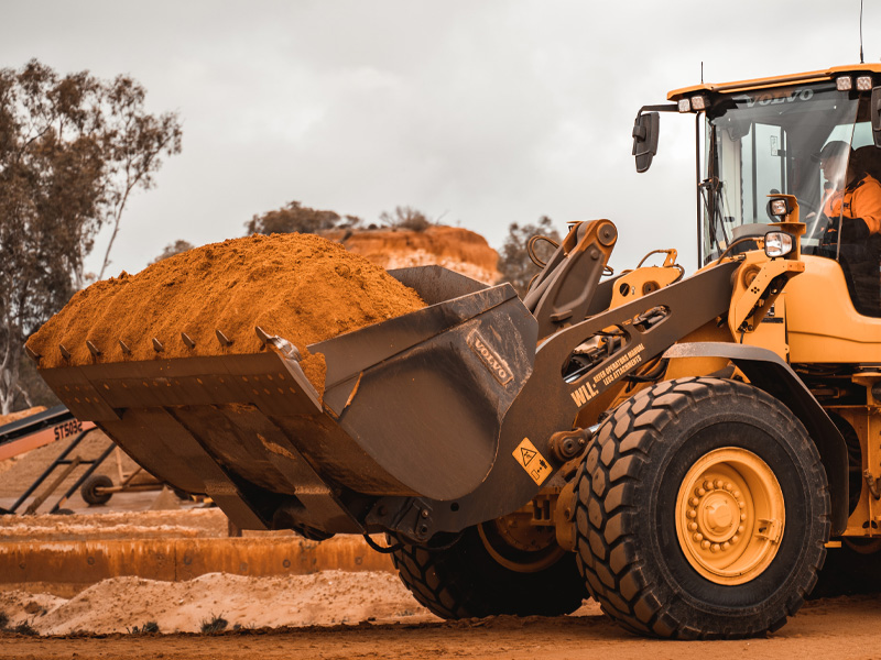 front end loader moving sand closeup