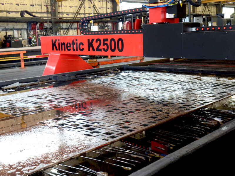 screen plate being worked on by machine
