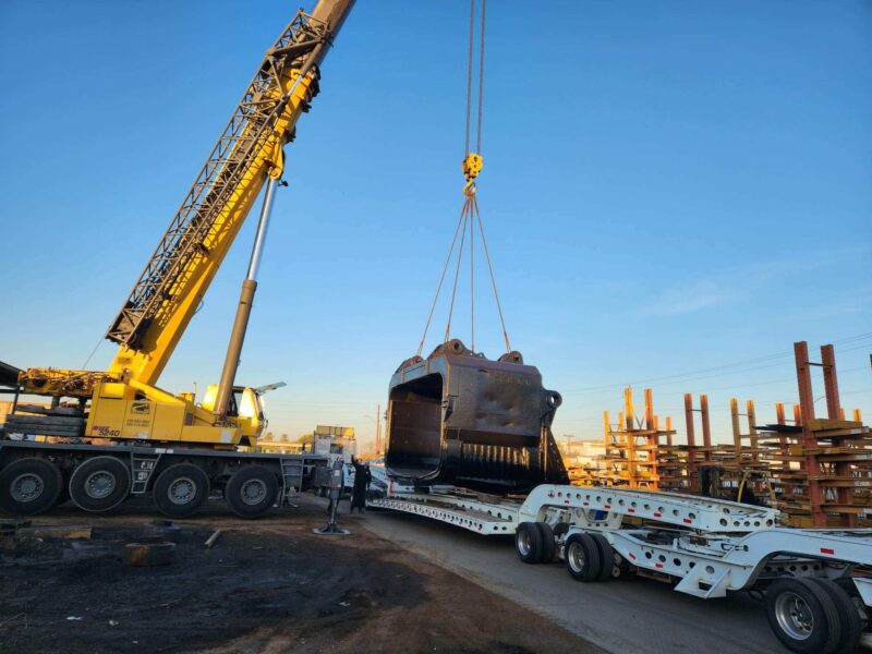large equipment being loaded for shipping
