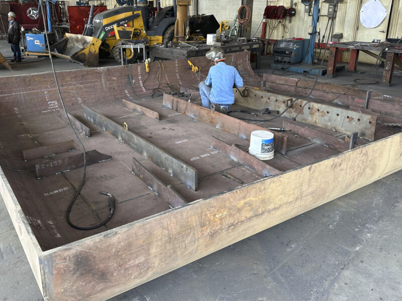 Man working on Recycling Ship Loader Pan