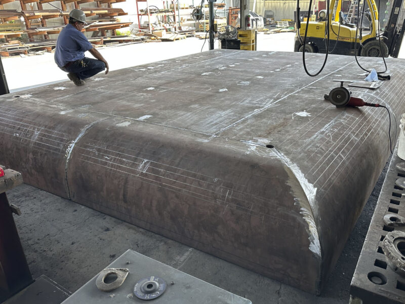Man standing on a Recycling Ship Loader Pan Build