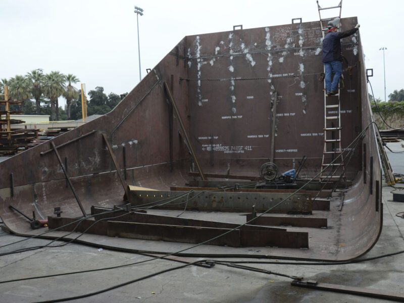 man working on top of ship Loader Pan