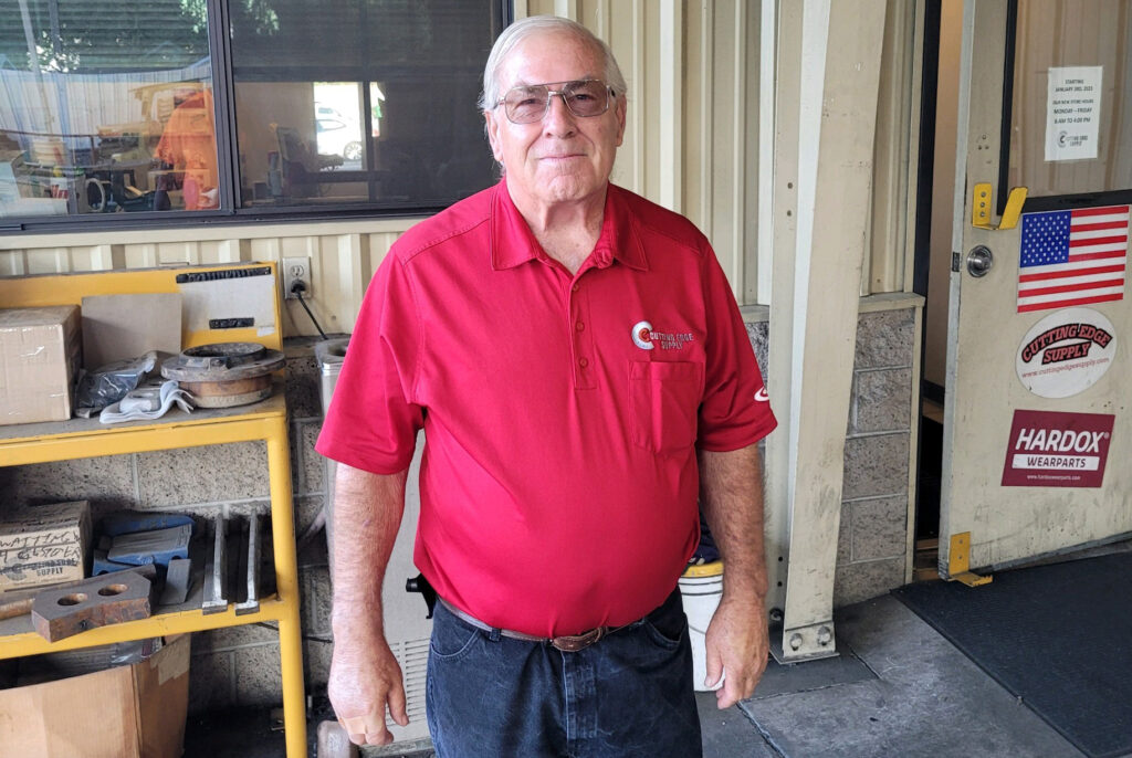 Man in Cutting Edge Supply Shirt